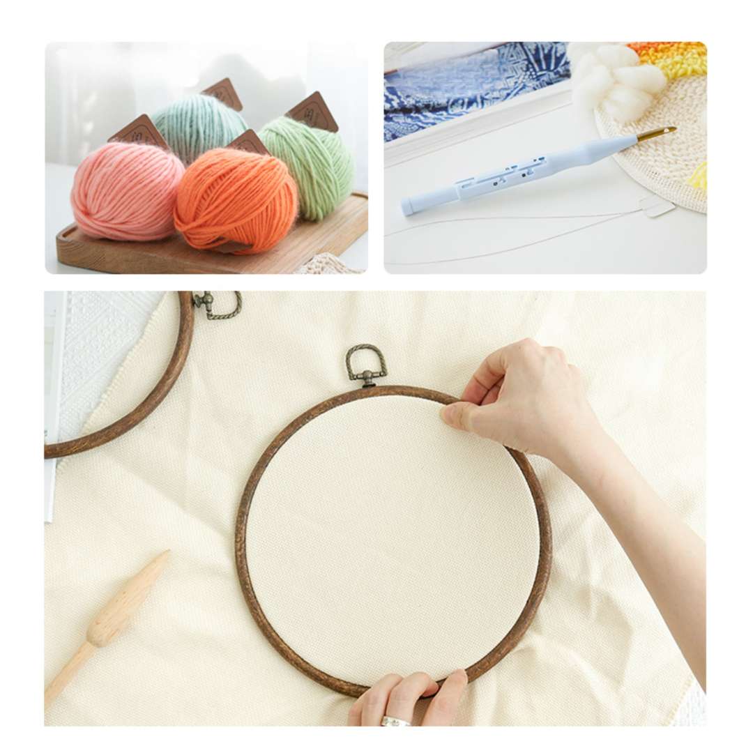 Materials for Puddingcase punch needle kit, including yarn, punch needle, embroidery hoop, and monks cloth for DIY crafts.