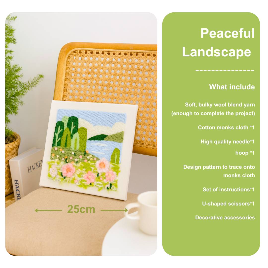 Punch needle embroidery kit with a landscape design on a table, accompanied by a green card detailing contents.