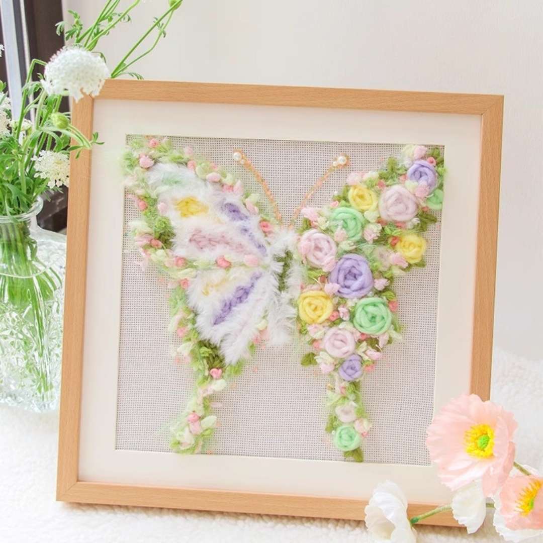 Puddingcase punch needle kit featuring a pastel butterfly with detailed floral accents, perfect for creating DIY embroidery home decor.
