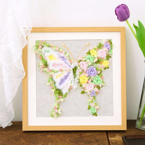 Puddingcase punch needle kit featuring a butterfly design adorned with colorful floral details, ideal for DIY embroidery crafts and home decor.