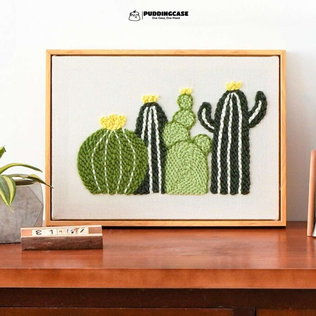 Puddingcase punch needle kit featuring a vibrant cactus design in shades of green and yellow, perfect for DIY embroidery and adding a modern touch to home decor.