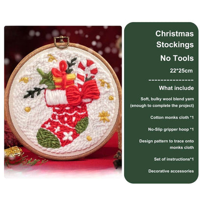 Front view of a Christmas stocking punch needle kit without tools, decorated with red bows and candy canes