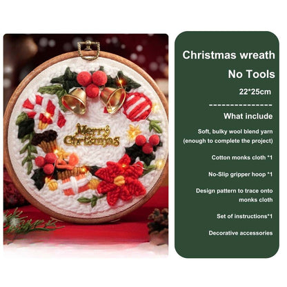 Front view of a Christmas wreath punch needle kit without tools, showcasing vibrant red flowers and golden bells
