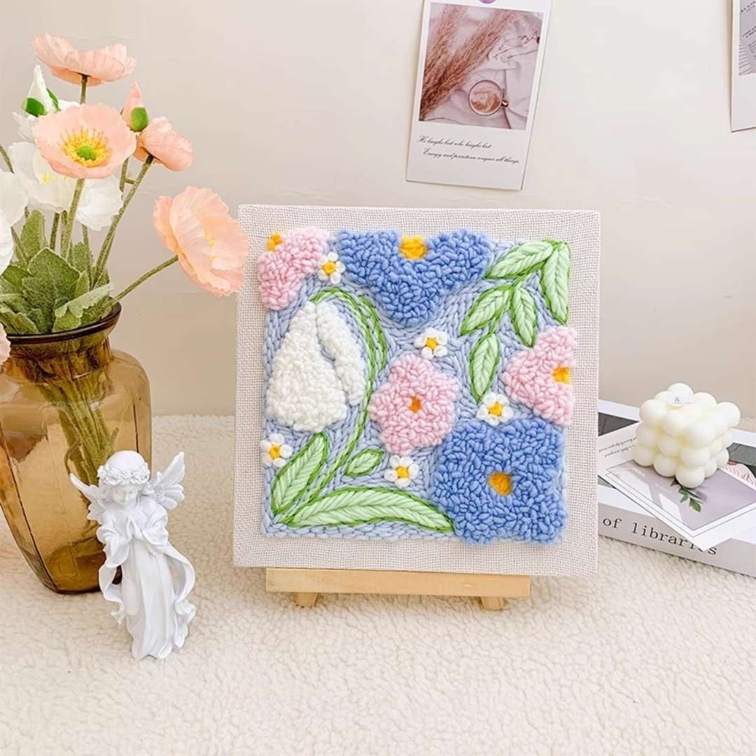 Closeup of the Puddingcase Flower-Blue Punch Needle Kit, highlighting vibrant blue floral embroidery details