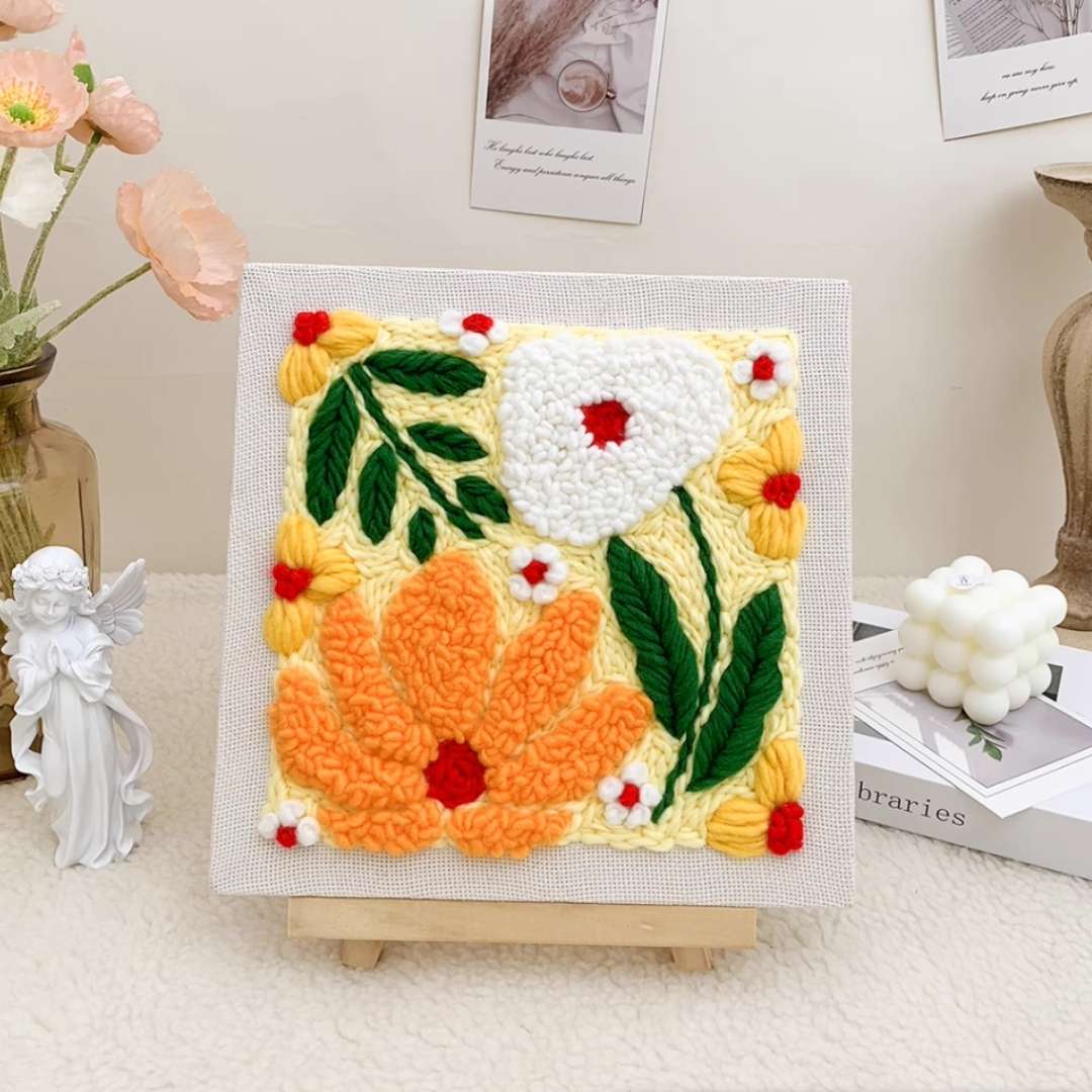 Closeup of the Puddingcase Flower-Yellow Punch Needle Kit, featuring a vibrant floral embroidery design