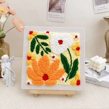 Closeup of the Puddingcase Flower-Yellow Punch Needle Kit, featuring a vibrant floral embroidery design