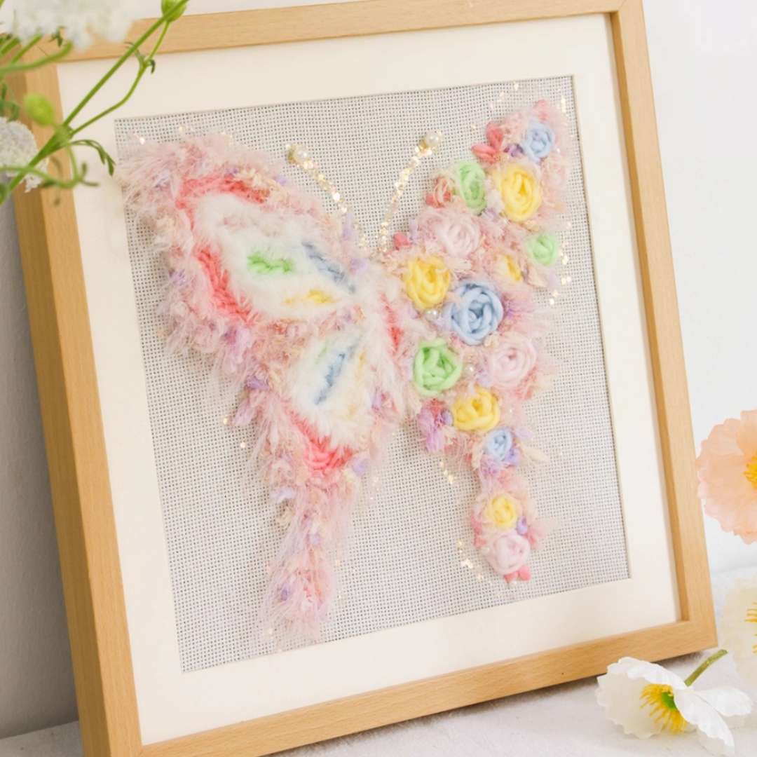 Puddingcase punch needle kit featuring a pastel butterfly adorned with soft floral accents, perfect for DIY embroidery and home decor enthusiasts.